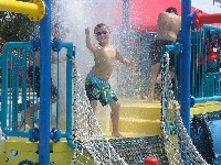 Boy dances at water park